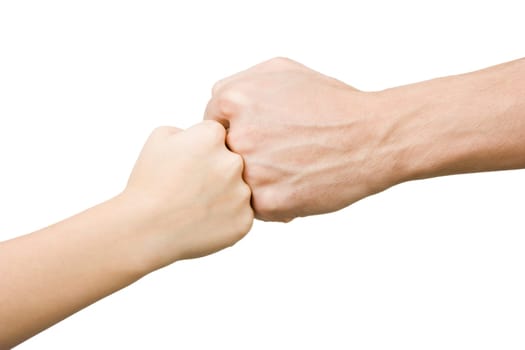 Fist of the child rests on the fist man on an isolated white background