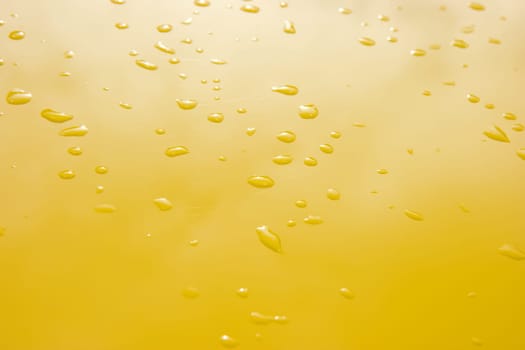 raindrops on the surface painted in yellow metal