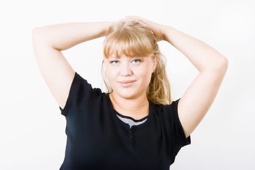 cute chubby blonde posing on a white background