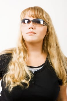 blonde girl in sunglasses on white background