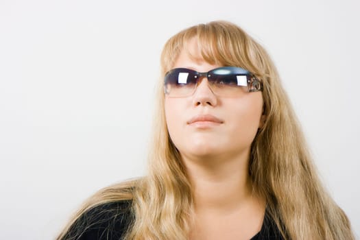 girl in sunglasses with long blond hair