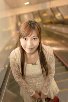 Asian beauty  take the escalator in Taipei, Taiwan, Asia.