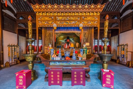 Shanghai, China - April 7, 2013: statues in the city god temple Chenghuang Miao  at the city of Shanghai in China on april 7th, 2013