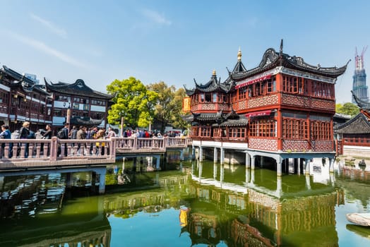 Shanghai, China - April 7, 2013: people outside of the oldest tea house of Fang Bang Zhong Lu  at the old city of Shanghai in China on april 7th, 2013
