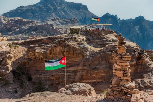 jordan flags floating  in nabatean petra  middle east