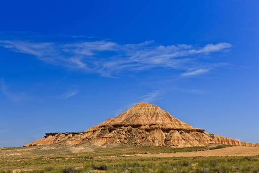 Desert landscape under the cloudy sky, Bardenas Reales, Navarra, Spain