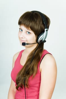 beautiful young smiling girl in headphones with microphone
