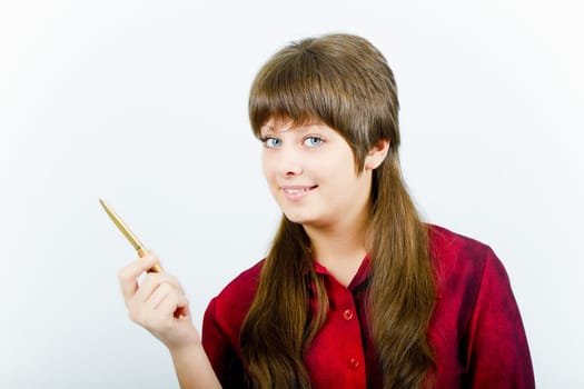 a smiling young attractive girl with a pen-pointer on a white background. Studio photography