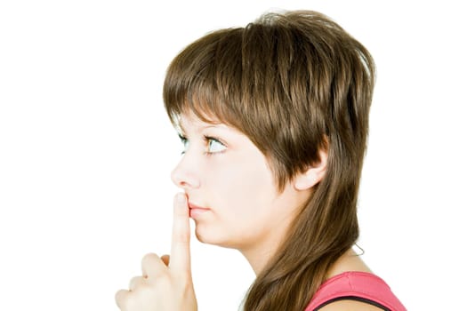 she presses the index finger to lips on an isolated white background
