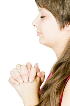 Teen girl prays at an isolated white background