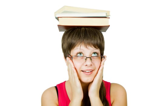 girl in glasses with the books on head on an isolated white background