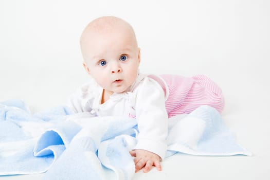 baby girl lying on a white background