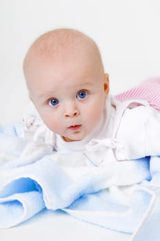 baby girl lying on a white background