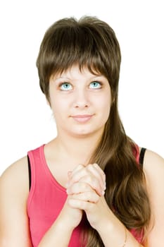 Teen girl prays at an isolated white background