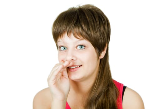 girl on an isolated background with his hand to his mouth