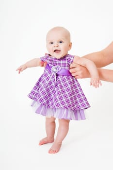 Baby in dress on a white background