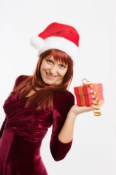 admiring a girl in a Christmas hat holding a New Year gift