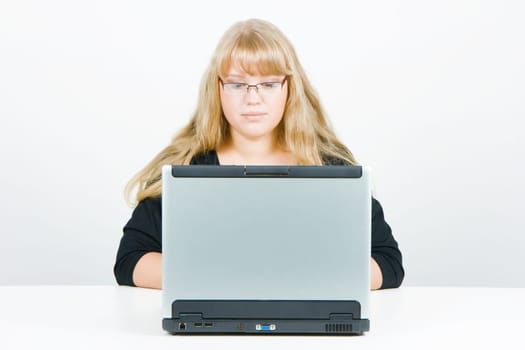 blonde with long beautiful hair with a laptop