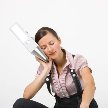 tired girl slept sitting on a white background