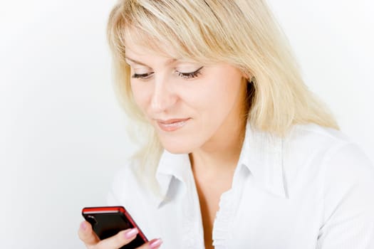 beautiful girl smiling blonde with the phone on a white background