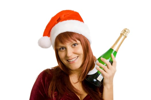 Smiling girl in a Christmas hat with a bottle of champagne in hand. White isolated background