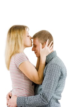 girl kissing a man in a forehead on an isolated white background