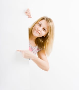 On white background the smiling young woman behind the white stand