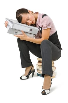tired businesswoman sleeping on the books on a white background