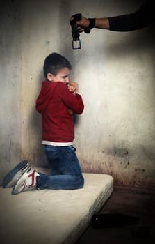 Abused child, curled up on a mattress in the middle of dirt gets beaten up by drunk and abusive parent.