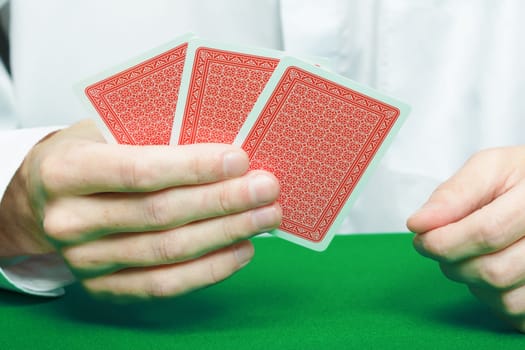 cards in the hands of gamblers. Card Game