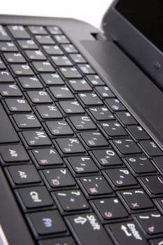 laptop keyboard closeup. Studio shot on white background