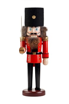 Large nutcracker in uniform insulated against a white background