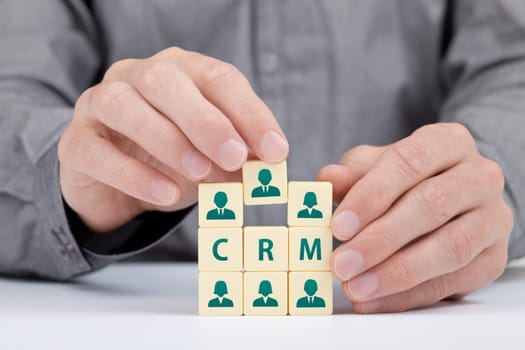 CRM (customer relationship management) concept. Businessman add new customer in database.