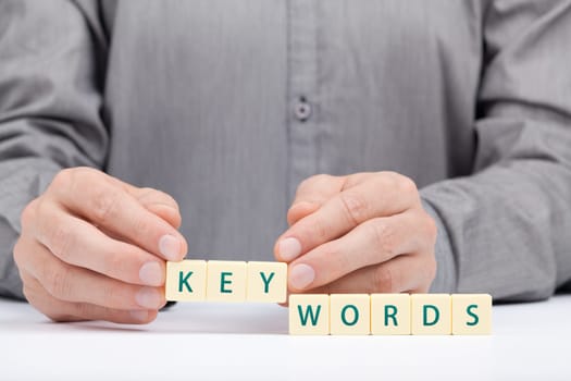 Keywords concept. Man complete word keywords.