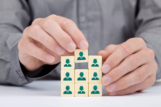 Human resources and social networking concept - recruiter complete team by one person (employee) represented by icon.