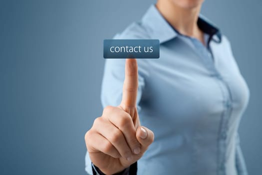 Contact us, customer care or helpline concept. Woman click on virtual button with contact us text.