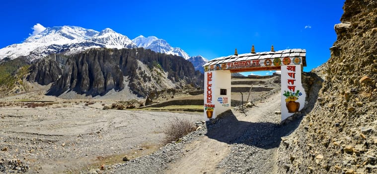Panorama of entrance gate to Himalayas Manang village, Nepal