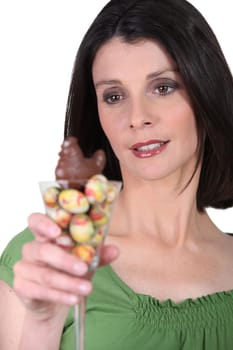 Woman with a cocktail glass full of Easter eggs