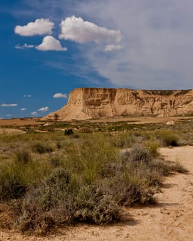 Desert landscape under the cloudy sky, Bardenas Reales, Navarra, Spain