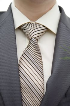 beige shirt, jacket and tie groom close