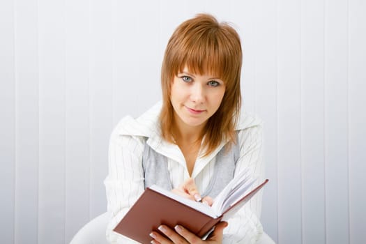 Business woman with notebook in the office
