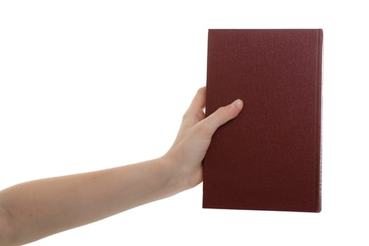 on white hand holds a closed book