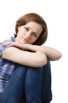 attractive girl in jeans and a blue plaid blouse. Isolated on white