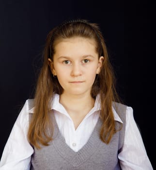 portrait of a girl with a white blouse and a gray vest
