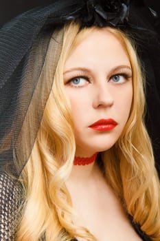 sad blue eyes attractive blonde in a black veil