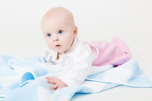 baby girl in the studio on the floor