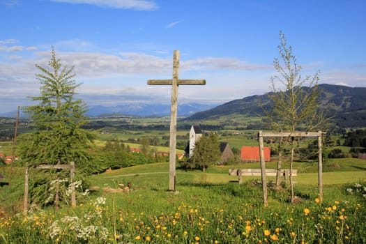 The cross in front of the Mittelberg church in the Allgäu