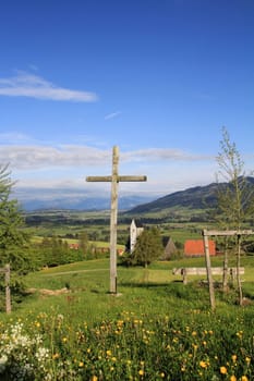 The cross in front of the Mittelberg church in the Allgäu