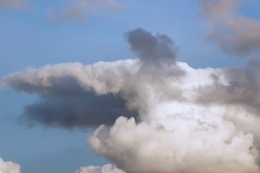 a natural storm shaped clouds in a beautiful blue sky