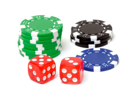 Poker chips and dices on white